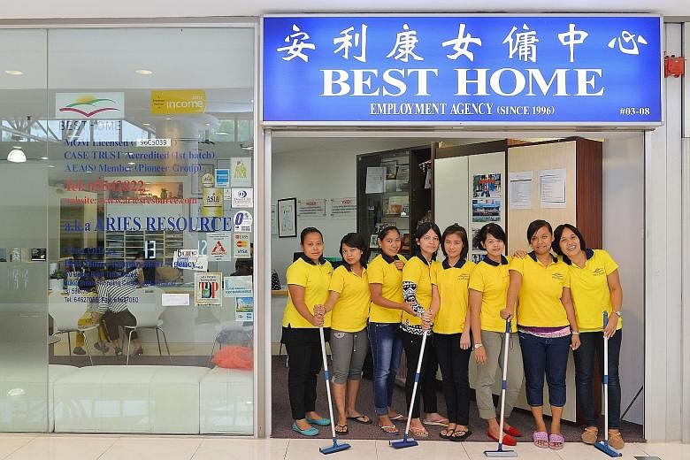 MOM's new requirement increases transparency by providing employers and maids - such as these at Best Home Employment Agency at Thomson Plaza - more information on their employment terms.