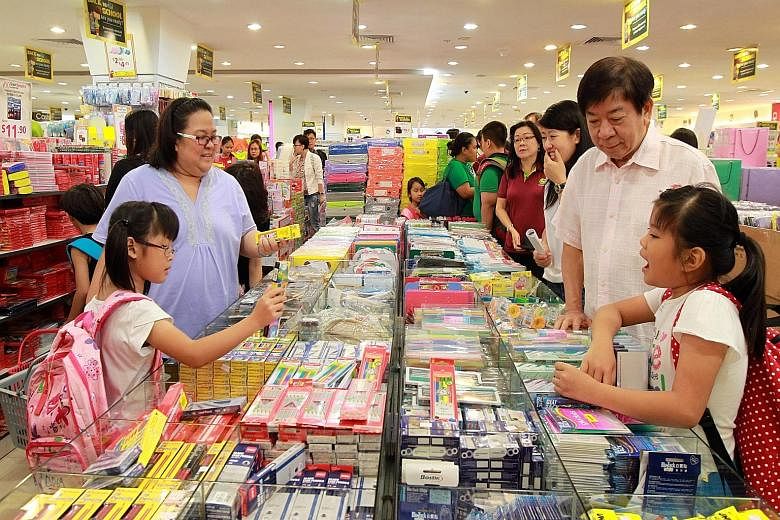 Mr Khaw, MP for Sembawang GRC, joined the children at Northpoint mall's Popular bookstore as they shopped for school materials ahead of the new school year.