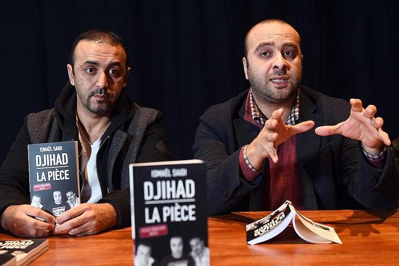 Belgian film-maker, playwright and stage director Ismael Saidi (left) and actor Reda Chebchoubi (far left) present the book adapted from Saidi's play "Jihad".