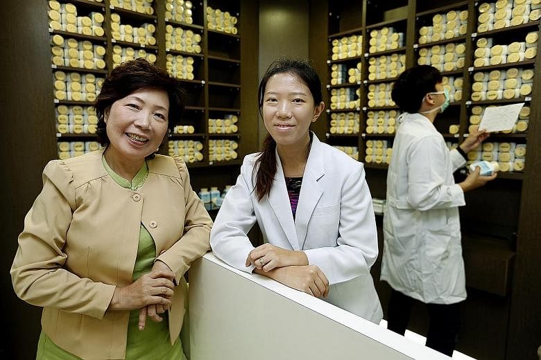 Singa Charity Medical coordinator and co-founder Tea Poh Choo (at far left) and TCM physician Jiang Xinlin (centre). The clinic in Veerasamy Road offers free consultations to patients, with a focus on those with cancer or metabolic diseases such as h