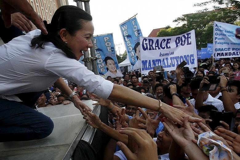 Ms Grace Poe greeting her supporters in October. The latest poll results show she is in a tie for the lead to be the next Philippine president with another candidate. However, the seven-man election commission ruled yesterday that Ms Poe is not quali