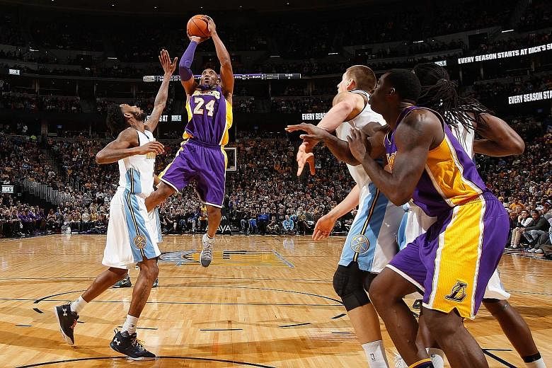 Kobe Bryant (second from left) taking a shot over Denver Nuggets' Will Barton. The LA Lakers star also did well in his defensive role, holding the hot-shooting Barton to two points in the second half.