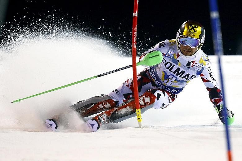 Marcel Hirscher of Austria clearing a gate during the first run in the men's slalom at the Alpine Skiing World Cup.