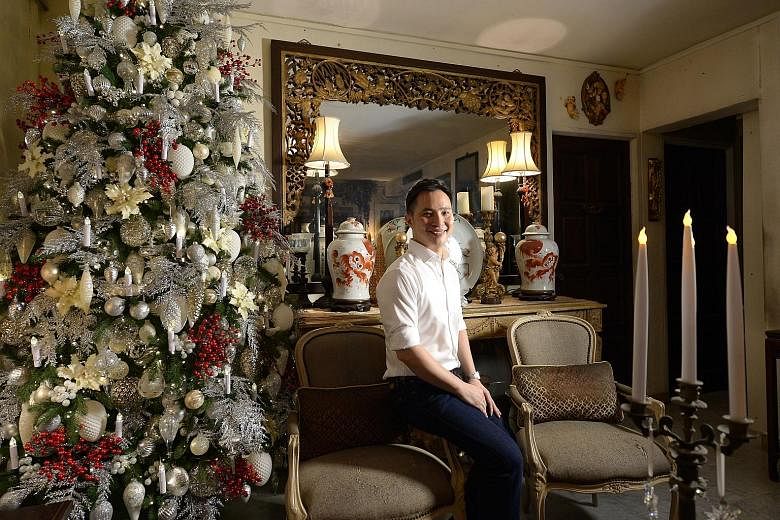 The 2m-tall Christmas tree (above left), which scrapes the ceiling, at Vincent Choo's flat in Potong Pasir.