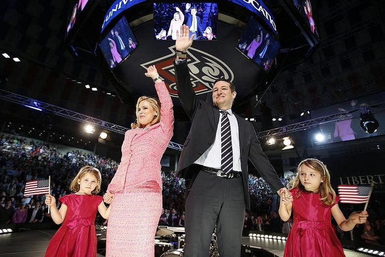 US Senator Ted Cruz with his wife Heidi and their daughters Catherine and Caroline, as he announces his candidacy for president in March. Mr Cruz is polling second in the Republican primary race.