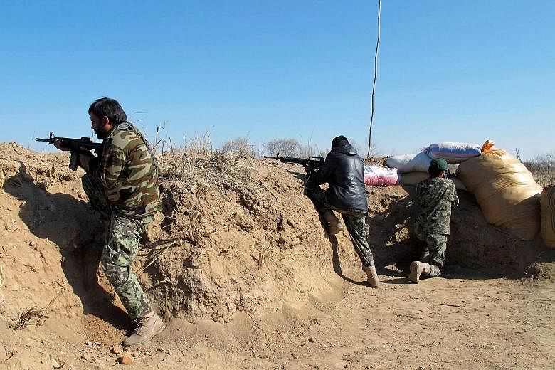 Afghan forces in an operation against Taleban fighters in Helmand on Tuesday. Kabul has rushed reinforcements to the province after the Taleban captured large swathes of a strategic district.