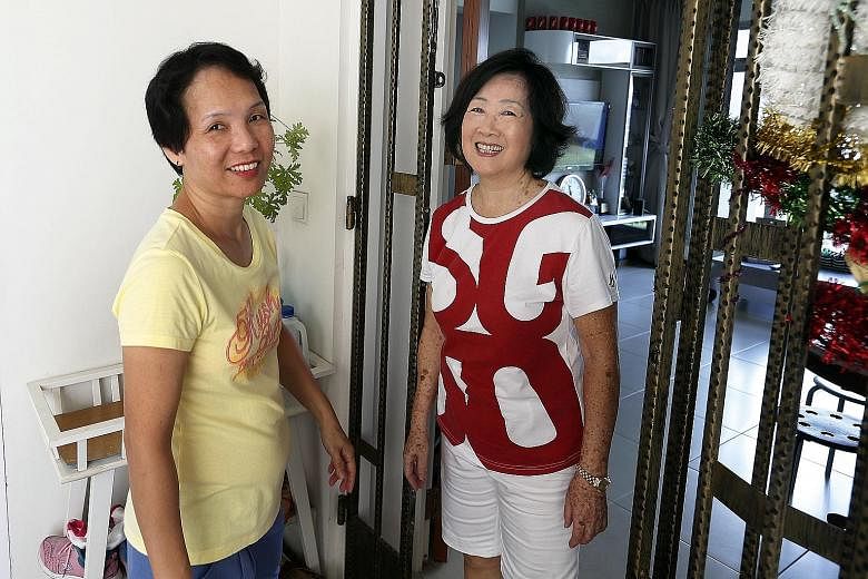 Neighbours Leong Yoke Lin (left) and Lai Su-Cheng chose to move into the same block in Teban Gardens Road after their old block on the same road was selected for Sers. Madam Idy Loo (fourth from left), her sister Ida (fifth from left), and their moth