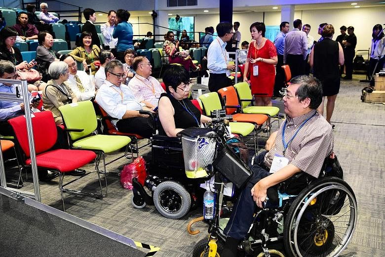 The special auditorium at the Enabling Village in Lengkok Bahru, made possible with a donation from UOB, is equipped with technology to help those with hearing aids, and has portable ramps, spaces reserved for wheelchairs and steps fitted with LED li