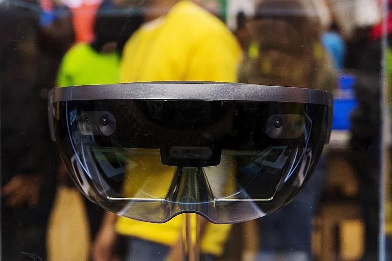 The Vive has a tracking system that allows the user to roam while using it. The Rift needs to be connected to a powerful computer and a separate tracking sensor. Microsoft's HoloLens blends 3D virtual visuals with the real world to create an augmente
