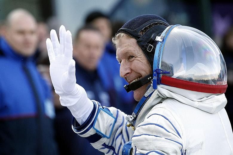 British astronaut Timothy Peake waving goodbye before his flight to the space station.