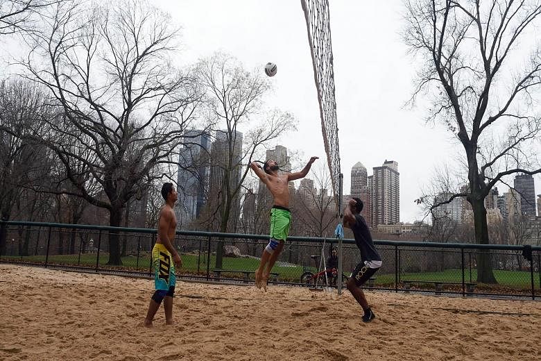 A group of men taking advantage of the warmth to play volleyball in New York's Central Park as temperatures peaked at 22 deg C last Thursday, the warmest Christmas Eve since records began in 1871.