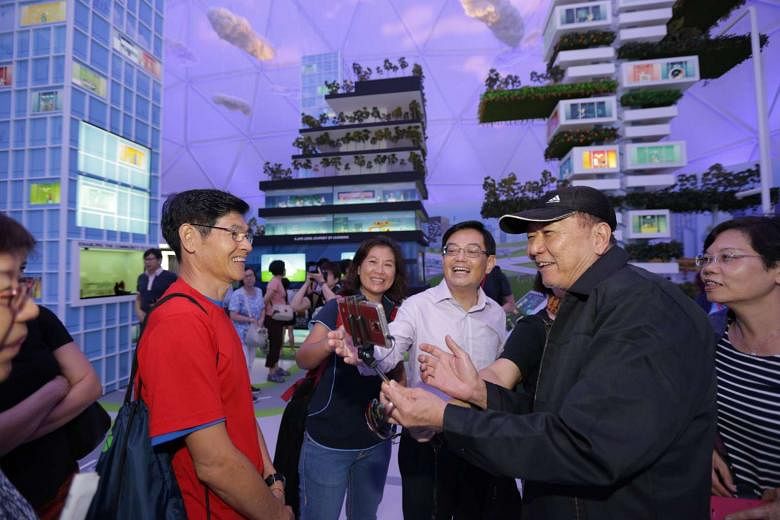 Minister Heng Swee Keat welcoming the first group of visitors to the Future Of Us exhibition at Gardens by the Bay on Dec 1, 2015.