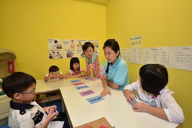 Ms Grace Tan with her pupils. She said those who attend the Little Bosses Boot Camp will be able to use the skills they have learnt to make the transition to primary school, where they will be handling real money on their own for the first time. 