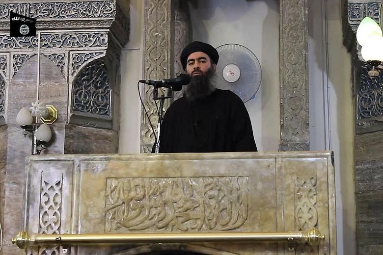 A file image from a video last year supposedly showing Abu Bakr al-Baghdadi. In his latest message, he called for more Muslims to fight for ISIS.
