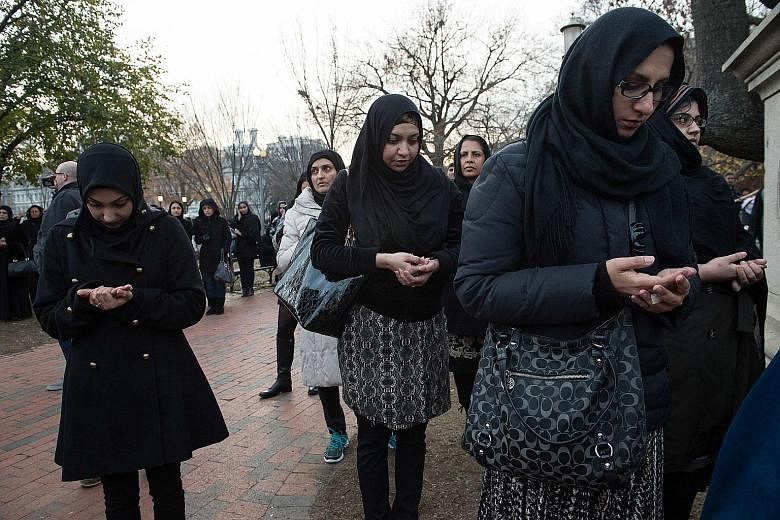Muslim women praying during an anti-terrorism demonstration outside the White House this month. It is a difficult time to be a Muslim woman in the United States, especially one wearing a headscarf.