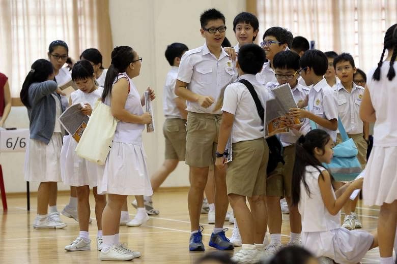Kong Hwa pupils after receiving their PSLE results on Nov 17, 2014.