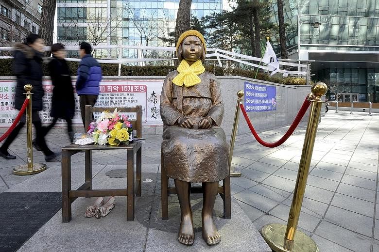 The bronze statue of a barefoot girl in a traditional hanbok dress in front of Japan's embassy in Seoul has become a symbol of comfort women. It will take an act of political courage in Seoul to relocate the statue, which has served as a potent symbo