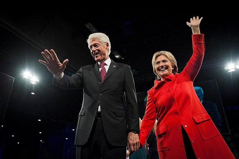 Former US president Bill Clinton and his wife, Democratic presidential candidate Hillary Clinton, greeting the crowd in Des Moines, Iowa, in October. Said Assistant Professor of Politics Hans Hassell from Cornell College: "Having Bill Clinton involve