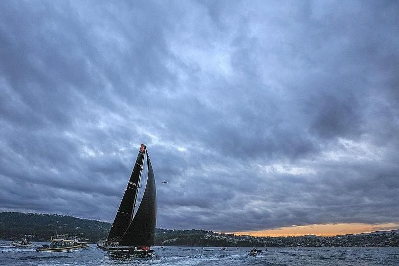 Comanche close to the finish line in Hobart last night, as skipper Ken Read's decision to "punch on through" and make running repairs to one of the broken twin rudders and daggerboard paid off.
