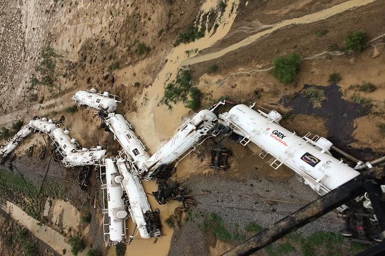 A police handout photo of the freight train carrying 200,000 litres of sulphuric acid that derailed near the town of Julia Creek in Australia. Police said there had been a minor leakage of sulphuric acid and spillage of diesel fuel from the accident 
