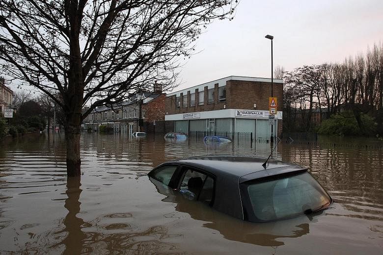 Streets and about 500 properties in the historic city of York were flooded after two rivers burst their banks on Sunday.