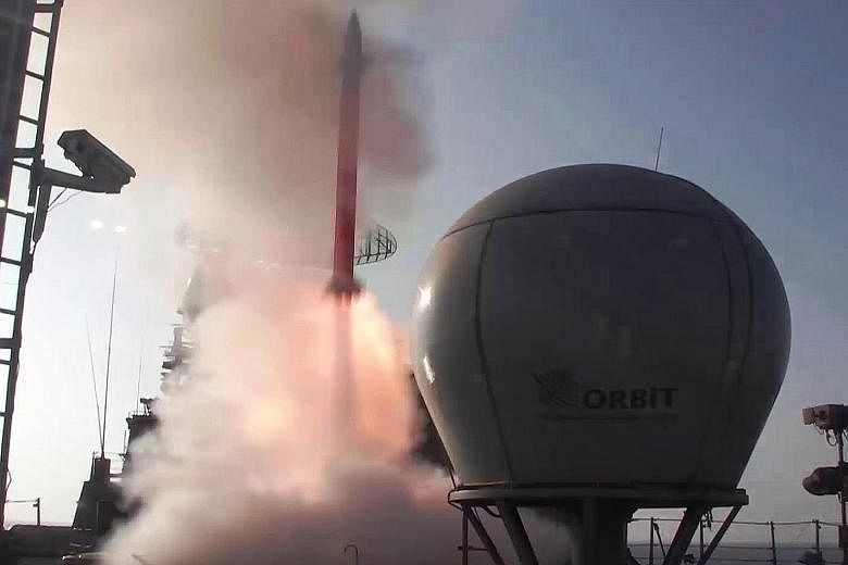 A Barak-8 long-range surface-to-air missile takes off from INS Kolkata, the Indian Navy's indigenous stealth destroyer in the Arabian Sea. According to a press statement, two missiles were fired on Tuesday and yesterday on high-speed targets during n