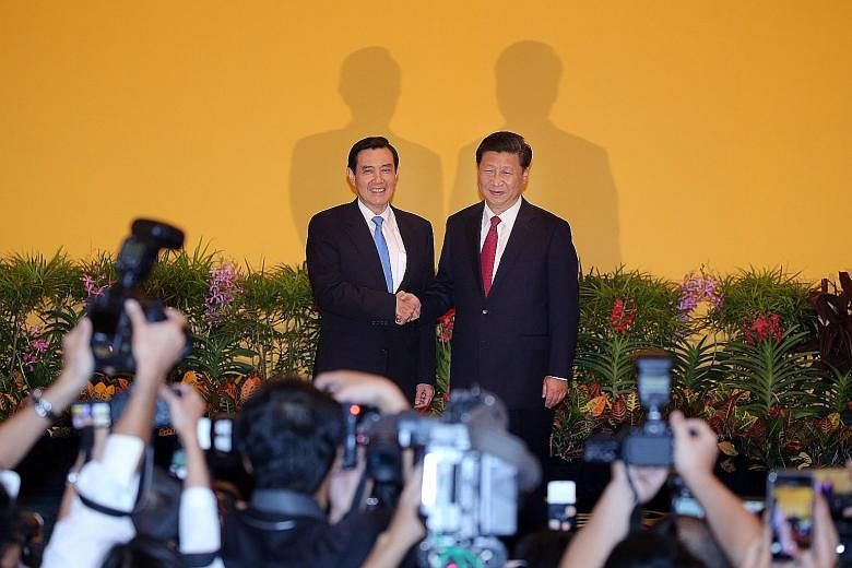 China President Xi Jinping shaking hands with Taiwanese President Ma Ying-jeou during their historic meeting at Shangri-La Hotel in Singapore on Nov 7. Professor Alfred Peng Peigen from Tsinghua University's School of Architecture is fronting the cam