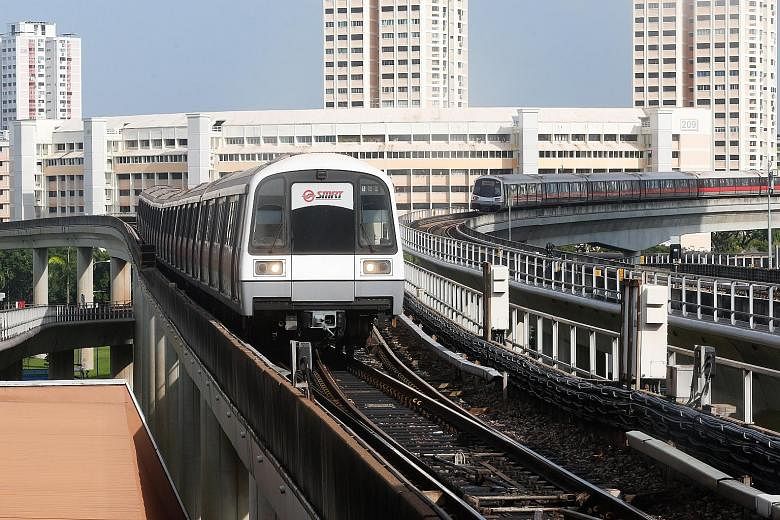 Trains waiting to move into Jurong East MRT station yesterday. SMRT said trains going between Joo Koon and Clementi had to travel at slower speeds owing to the faulty track circuit, which is used to track and control the speed of trains.