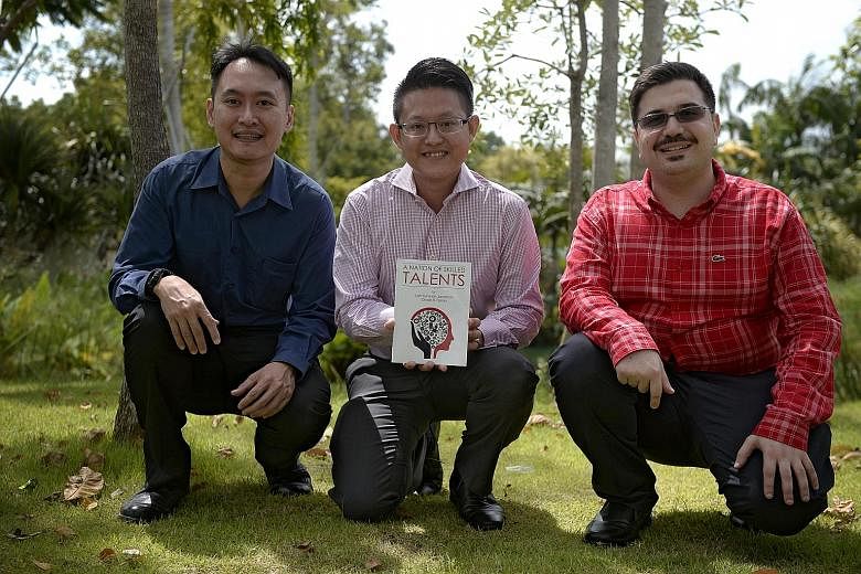 (From left) Dr Loh with Mr Wayne Lim, an alumnus of Nanyang Polytechnic who features in the book, A Nation Of Skilled Talents, and the book's co-author and graduate student Chadi EL Farran.