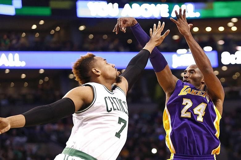 Lakers star Kobe Bryant (right) shooting the ball over Celtics centre Jared Sullinger. The Lakers won 112-104 to end a four-game losing streak.