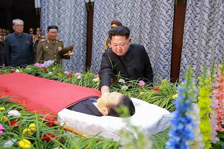 Mr Kim Jong Un paying his last respects to Mr Kim Yang Gon, whom he described as