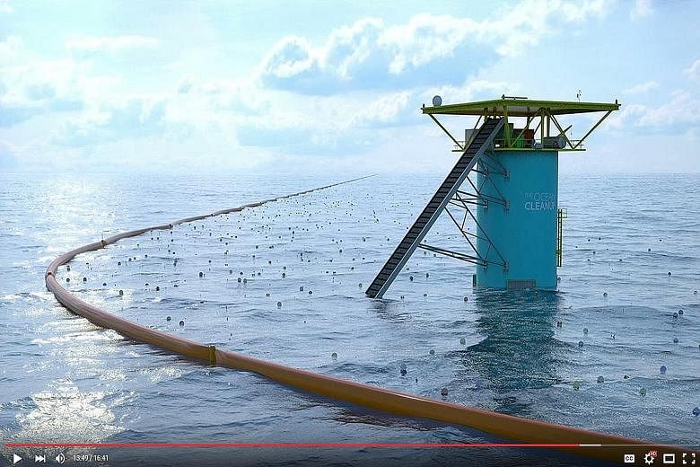 The Ocean Cleanup video grabs show the floating dam's boom (above) which is used to trap floating garbage, and its white mesh (left) which is used to collect plastic and other flotsam.