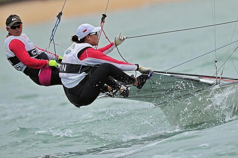 Singapore sailors Griselda Khng (left) and Sara Tan won gold in the 49erFX skiff class at the SEA Games and aim to make it to Rio after internal trials. Much of the $60,000 total funding for their quest has been provided by their parents.