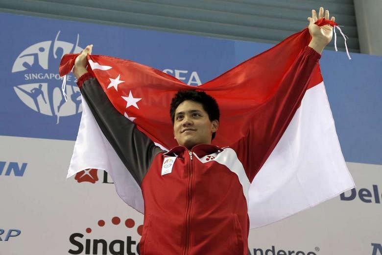 Singapore's Joseph Schooling celebrates winning the gold medal at the 2015 SEA Games in Singapore.