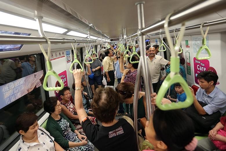 Commuters taking a ride on the Downtown Line 2 last Sunday, the first day it was opened to the public. This year will see improvements to the nation's rail transport system, including upgrades to the signalling system along the North-South Line and t