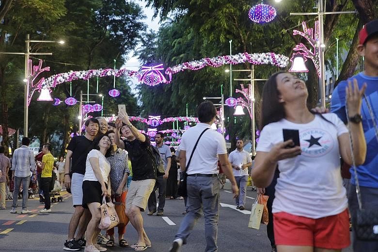 After a day of islandwide showers, the skies cleared up just in time for merrymakers to enjoy Pedestrian Night On Orchard Road yesterday. With Christmas decorations still lit up, yesterday's edition was an extra-colourful affair. But there was also a