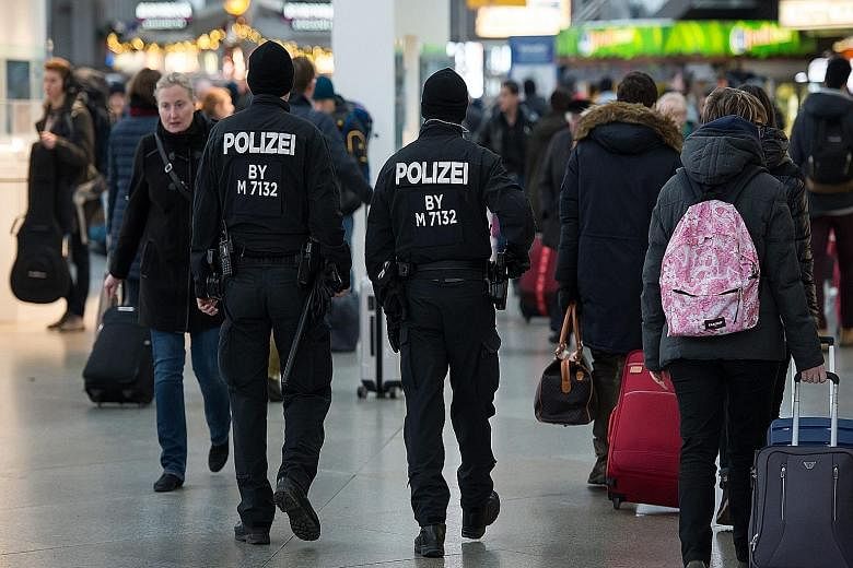 German police patrolling the Central Railway Station in Munich yesterday. The city was partially evacuated following a terrorist threat on New Year's Eve.