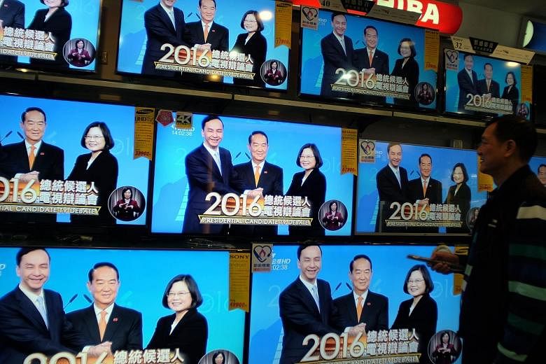 Taiwanese presidential candidates (from left) Eric Chu of the ruling Kuomintang, James Soong of the People First Party, and Tsai Ing-wen of the Democratic Progressive Party during the second and final televised debate yesterday. Ms Tsai, widely consi