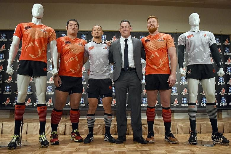Sunwolves head coach Mark Hammett (in suit) with his players (from left) Shinnosuke Kakinaga, Yuki Yatomo and Australian Edward Quirk during a press conference in Tokyo on Dec 21.