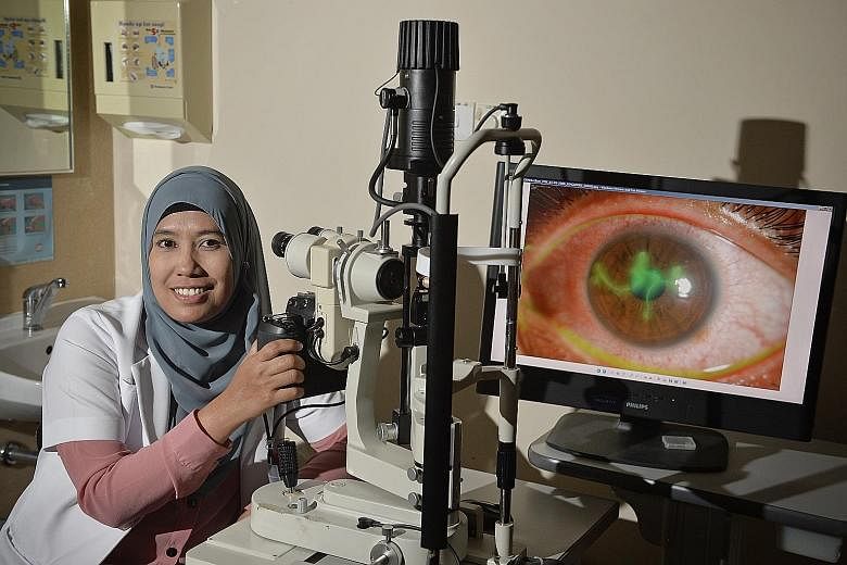 Ophthalmic technician Khatijah with the equipment she uses in her work.
