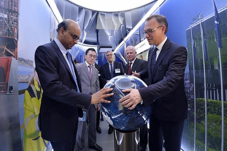 Deputy Prime Minister Tharman Shanmugaratnam (left) and Kuehne + Nagel chief executive Detlef Trefzger at the opening ceremony yesterday of the Swiss-based firm's new 538,195 sq ft logistics hub in Pioneer Crescent. The $143 million hub is the firm's