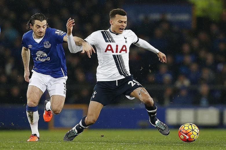 Tottenham's Dele Alli, who netted the equaliser just before half-time, showing his style as Everton's Leighton Baines struggles to catch him.