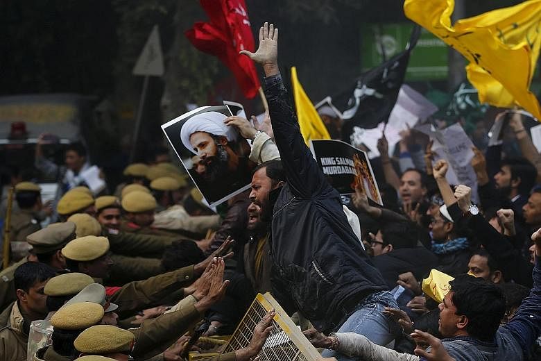 Shi'ite Muslims protesting against the execution of cleric Nimr al-Nimr in front of the Saudi Embassy in New Delhi on Monday.