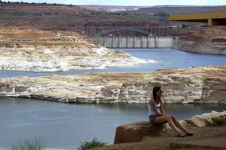 The Glen Canyon Dam (background) across the Colorado River near Page, Arizona. Water consumption for power generation is expected to double in 40 years, according to a study published in the journal Nature Climate Change.
