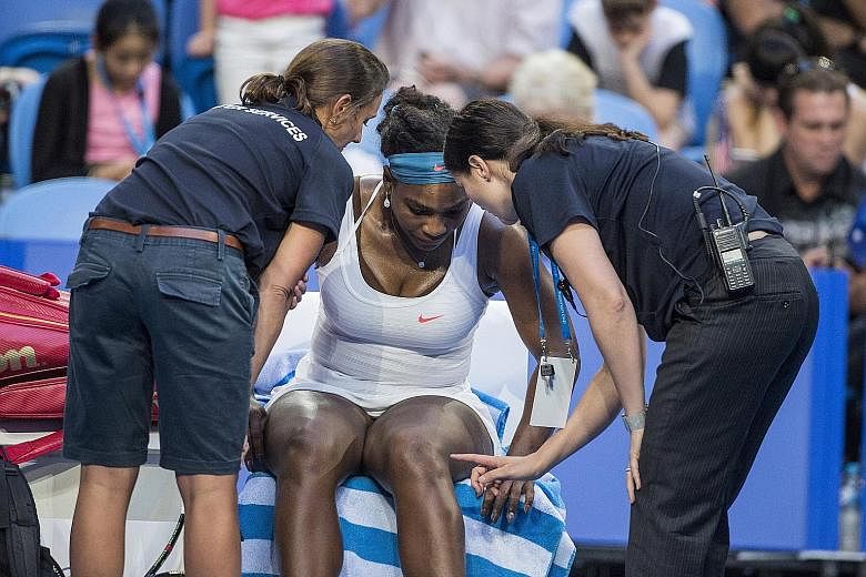 Serena Williams seeking the help of medical staff before retiring from her Hopman Cup singles match against Australian Jarmila Wolfe on Tuesday. The American, who won three Grand Slam titles last year, had initially been confident of returning to act