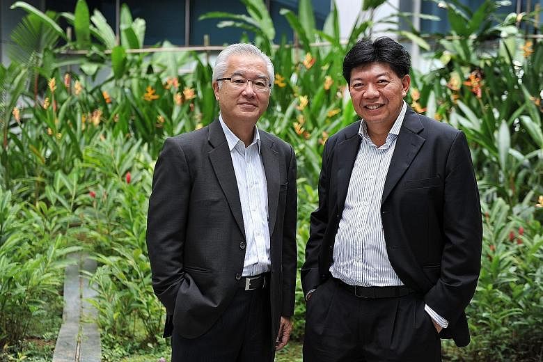 GS Holdings' Mr Foo (right), seen here with executive chairman and CEO Pang Pok, is confident the company will do well and is in for the long term.