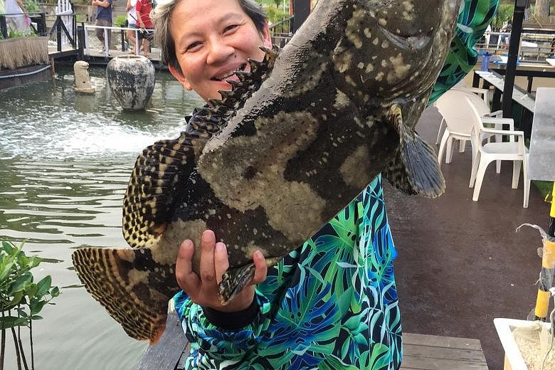 Founder of 77th Street Elim Chew, with a 8.4kg grouper she caught at D'Best Fishing.