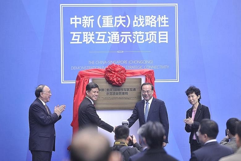 Singapore's labour chief Chan Chun Sing (second from left) and Chongqing party chief Sun Zhengcai (third from left) unveiled a plaque for the third Sino-Singapore project's administrative committee office at an outdoor ceremony yesterday in Chongqing