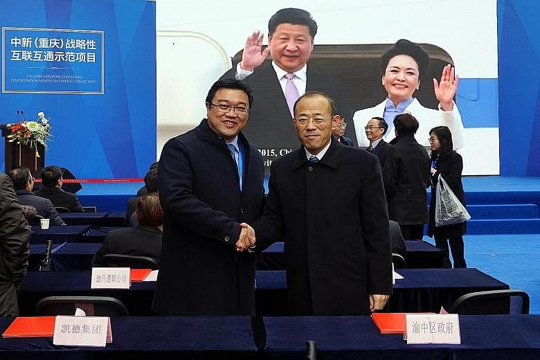 CapitaLand China CEO Lucas Loh (at left) and Yuzhong District Mayor Hu Wan Tai at the MOU signing to jointly set up the Sino-Singapore Collaboration Centre at Raffles City Chongqing.