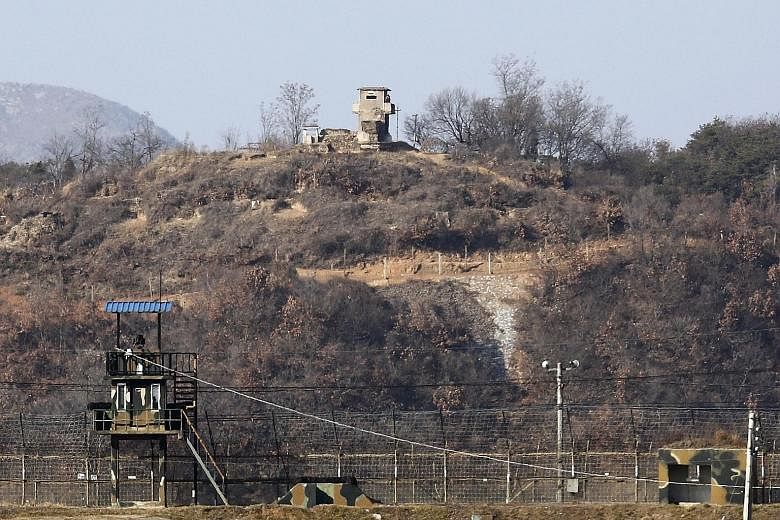 South Korean tanks moving near the demilitarised zone at Paju in Gyeonggi province yesterday as the military shored up defences near loudspeakers blasting propaganda aimed at the North.